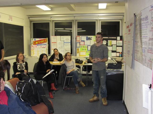 P. Nandin explains his poster about guitar songs.